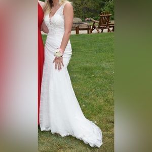 Beautiful white lace prom or wedding dress. Worn once for a couple hours.